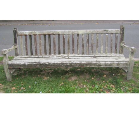A substantial weathered teak garden/park bench with slatted seat and back, 248cm (8ft long) x 98cm high