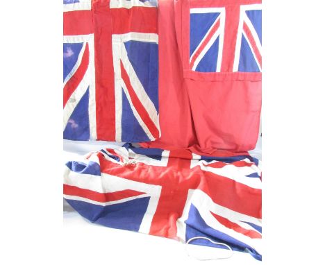 Two vintage linen Union Jacks both 132cm x 67cm (one a bit tatty) and a vintage linen Red Ensign 147cm x 90cm (with repairs)