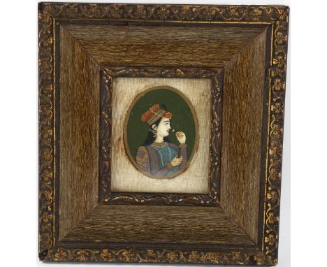 Indian School, miniature painted portrait on ivory, woman with a flower, unsigned, framed, overall 18cm x 16.5cm 