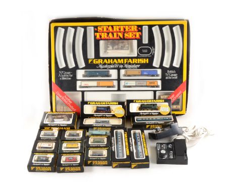 N gauge model railways; a collection to include two steam engines, diesel engine, wagons and passenger coaches, mostly boxed.