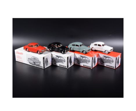 Somerville 1:43 scale white metal models; three no.121 Volvo PV 444A in green, white and black, and a no.124 Volvo Amazon in 