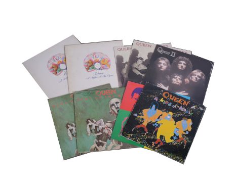Queen; nine vinyl LP records including A Night at the Opera (x2), The Works (x2), A Kind of Magic, Queen II, News of the Worl