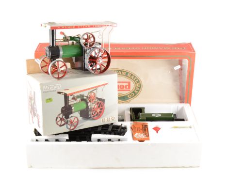 A RS1 Mamod live steam railway engine set, with wagons and track, and a Mamod TE1a steam tractor Showman's engines, both boxe