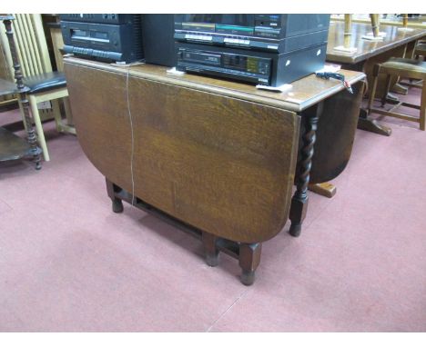 1930s Oak Drop Leaf Dining Table, with gateleg action and barley twist supports, 72cm high 106cm wide