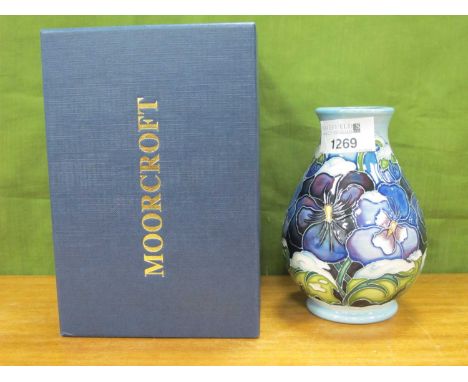 A Moorcroft Pottery 'Christmas Pansy' Design Baluster Vase, impressed and painted marks, signed R. Bishop, 13cm high (boxed).