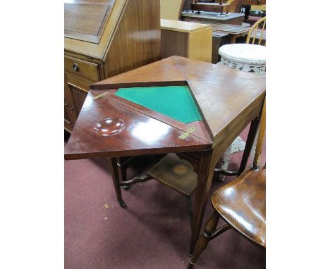 An Edwardian Mahogany Inlaid Envelope Table, with swivel top, green baized interior with guinea wells, single drawer on taper