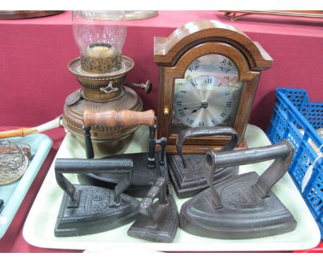 Brass Oil Lamp, five flat irons. Wm Widdop mantle clock:- One Tray.