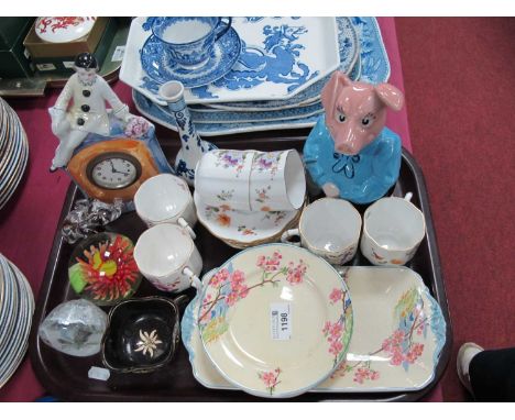 Derby Posies, six coffee cups and saucers, Germany Pierriot cased mantle clock, Wade piggy bank, etc:- One Tray