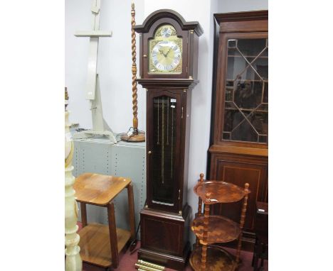 Tempus Fugit Longcase Clock, with a brass dial, three brass weights, trunk with a glazed door, on a plinth base.