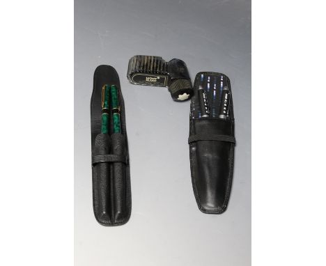 A CASED WATERMAN PEN SET, comprising fountain pen and roller ball pen, together with another modern pen and pencil, and a bot