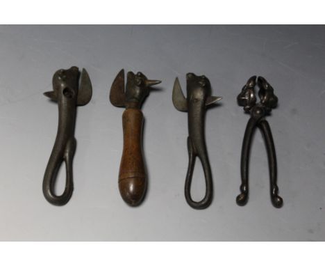 A COLLECTION OF NOVELTY VINTAGE 'BULLY BEEF CAN OPENERS', together with a pair of cast lion mask nut crackers  (4)