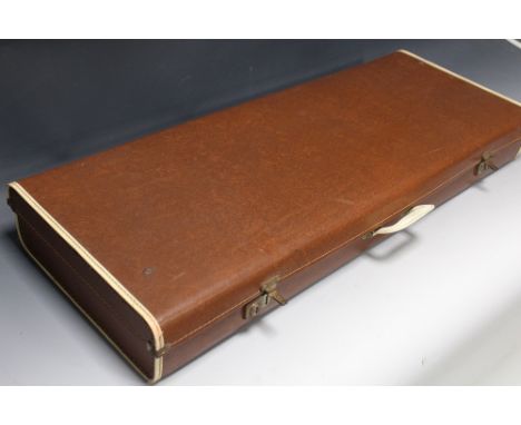 A VINTAGE HARDSHELL GUITAR CASE including acoustic guitar