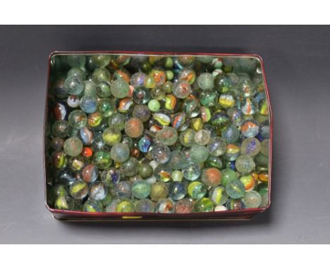 A TIN OF VINTAGE GLASS MARBLES, various types and sizes, all play worn