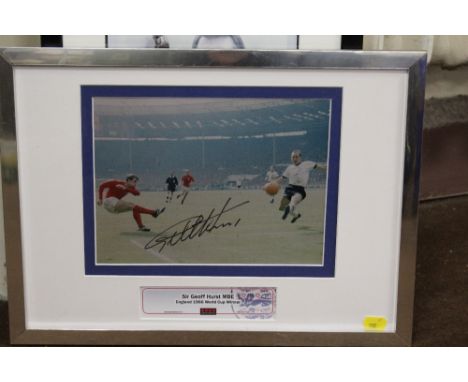 FOOTBALL - A FRAMED AND SIGNED COLOURED PRINT OF SIR GEOFF HURST SCORING IN THE 1966 WORLD CUP FINAL, glazed, certificate of 
