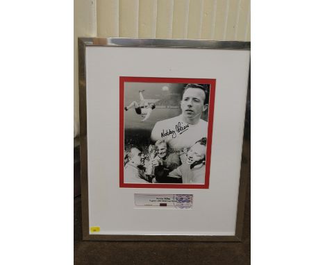 FOOTBALL - A SIGNED FRAMED NOBBY STILES BLACK AND WHITE PRINT, glazed, certificate of authenticity