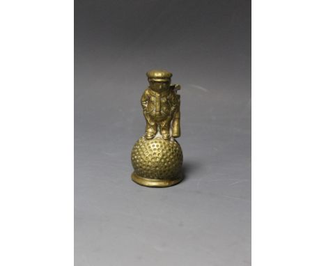 AN EARLY 20TH CENTURY 'DUNLOP 31' BRASS ADVERTISING TABLE BELL, missing clapper, depicts a golf ball headed caddy standing on