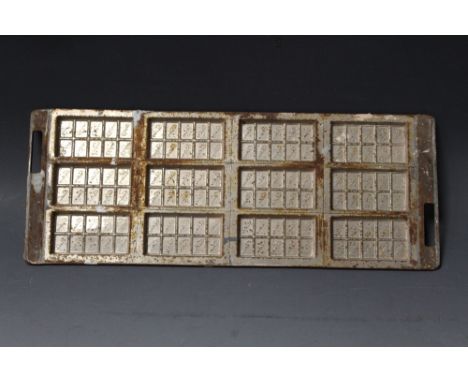 A VINTAGE 'CADBURY' CHOCOLATE BAR MOULD, for twelve bars, each of ten sections, made from moulded plated steel, 18 cm x 48 cm