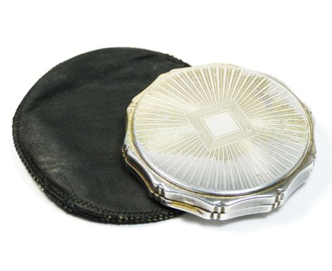 A silver compact, by Kigu, London 1959, with engine turned star burst decoration, 7cm.