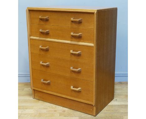 E. Gomme for G Plan, a light oak chest of two long drawers over three long drawers, signed to top drawer, 77 x 46 x 87cm. 