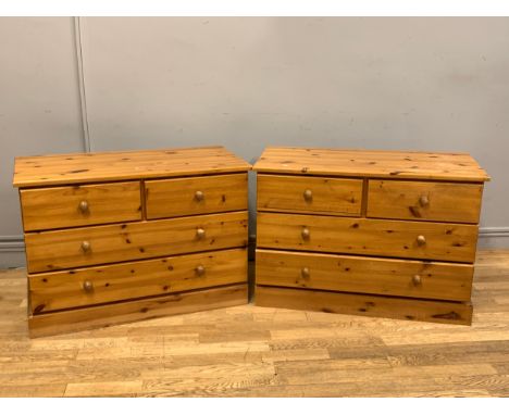 A matching pair of drawers, stained pine, two small drawers over two long, button handles, 94cm x 65cm x 45cm 