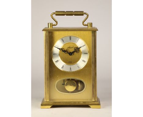 A mid 20th century German brass case mantel clock, having silvered chapter ring with roman numerals, incorporating an 8 day m
