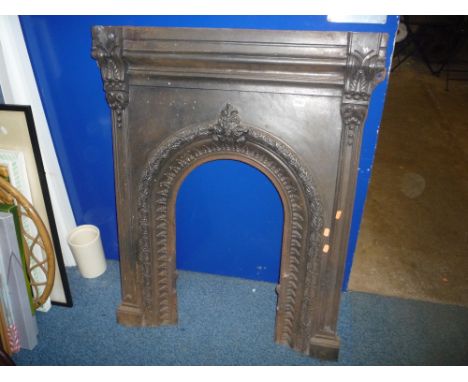 A CAST IRON FIREPLACE, (no mantel shelf, etc)