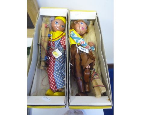 TWO BOXED PELHAM PUPPETS, 'Cowgirl' and 'Clown', both in damaged yellow lidded boxes (clown boxed marked 'Poodle'), with a bo