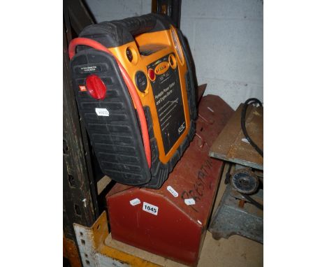A METAL TOOL BOX, containing a quantity of hand tools and a portable engine starter (2)