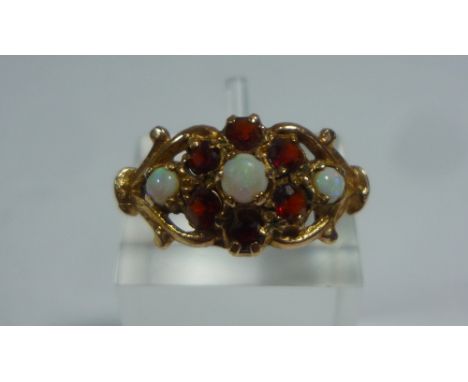 A 9CT OPAL AND GARNET DRESS RING, size N 1/2