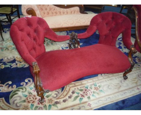 A VICTORIAN RED UPHOLSTERED BUTTON BACK SOFA, with carved mahogany frame