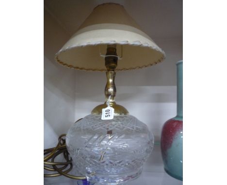 A CUT GLASS LAMP BASE, with shade