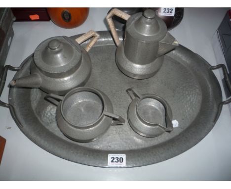 A FOUR PIECE PEWTER TEA SERVICE and a twin handled tray (5)