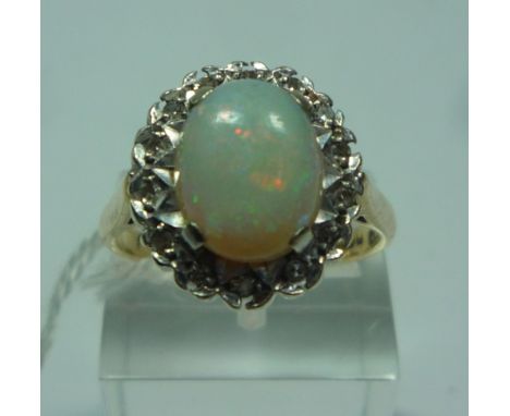 A 9CT GOLD OPAL AND DIAMOND RING, size N 1/2