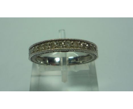 A 14CT WHITE GOLD HALF ETERNITY RING, size L 1/2, boxed