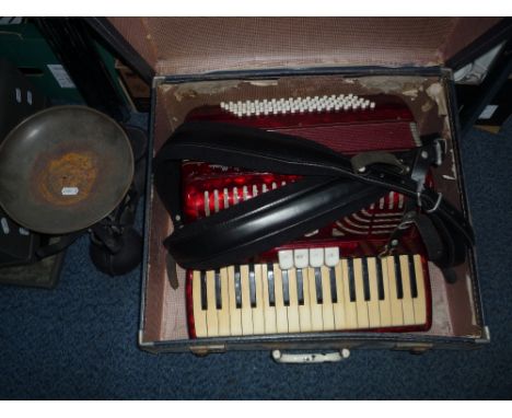 A CASED ACCORDIAN, a cased Everest typewriter and a set of scales (3)