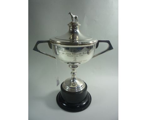 A SILVER LIDDED TWO HANDLED TROPHY, with standing dog finial, inscribed for Sutton Coldfield & District Association, on circu