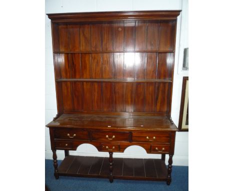 A GEORGIAN STYLE MAHOGANY DRESSER, the plate rack above an arrangement of various sized drawers and lower shelf