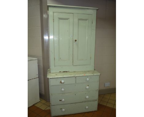 A PAINTED PINE CHEST, of two short and three long drawers with ceramic handles and a seperate two door cupboard top