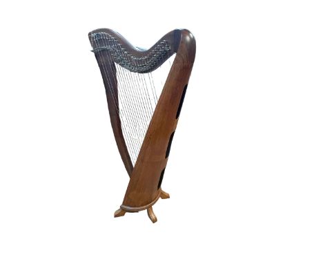 Harp, harp case and spare strings.