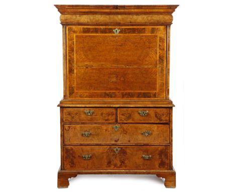 A Queen Anne walnut escritoire, the moulded cornice above a cushion drawer, the cross and feather banded burr veneered fall r
