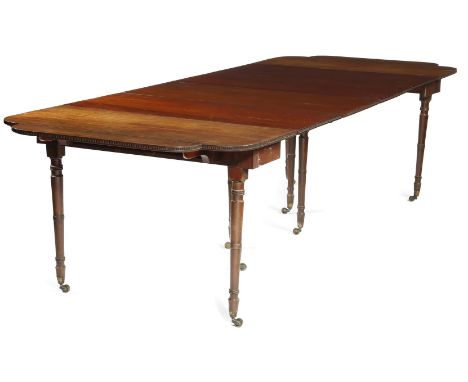 A Regency Scottish mahogany extending dining table, in the manner of William Trotter, the drop-leaf top with breakfront ends 