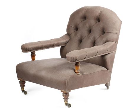 A late Victorian walnut open easy armchair by Howard & Sons Ltd, with later button upholstery, with turned front legs and bra