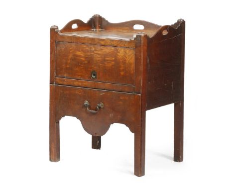 A George III mahogany tray-top bedside commode, the gallery pierced with three handgrips, above a hinged and retracting door,