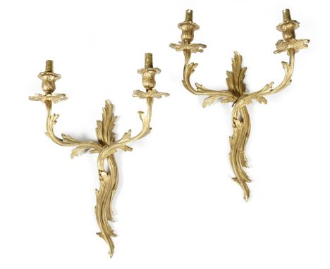 A set of four ormolu twin-light wall appliques in Louis XV style, 43.3cm high, 31.7cm wide. (4)click  here to view the page t