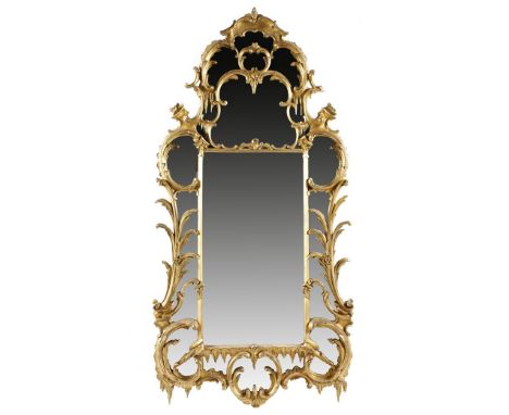 A Victorian giltwood wall mirror in Chippendale style, with a central rectangular bevelled plate, surrounded by marginal plat