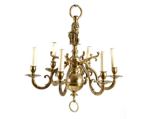 A Dutch brass six-light chandelier in 17th century style, the stem with a lion holding a coat of arms, above scroll arms and 