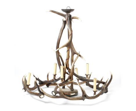 An antler six-light chandelier, of open crown form, with an opaque glass shade, 90.9cm high, 94cm wide.click  here to view th