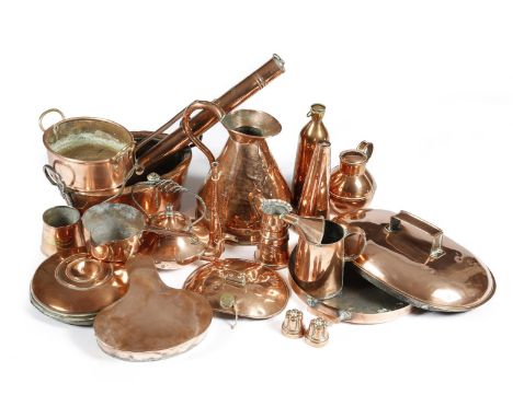 A collection of copper ware, including: two small jelly moulds, a kettle, warmers, a haystack measure, a flask with a brass l