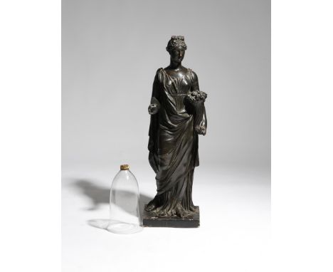 A Regency patinated plaster figural torchère, of a classical maiden personifying summer and holding a cornucopia of flowers a