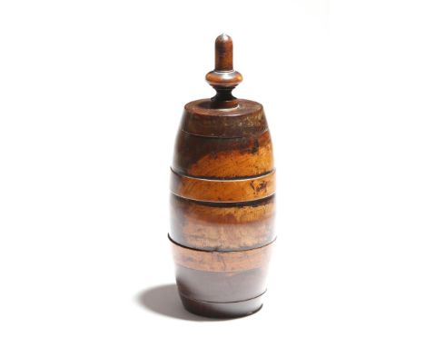 A George II treen lignum vitae coffee grinder or mill, of barrel shape and with a screw-off stylised acorn finial, the body i